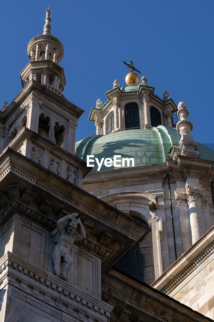 LOW ANGLE VIEW OF CHURCH AGAINST BUILDING