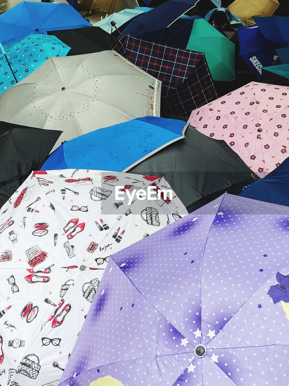 umbrella, art, protection, blue, large group of objects, high angle view, no people, multi colored, fashion accessory, security, retail, day, pattern