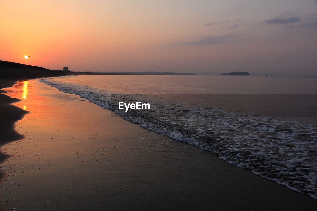 Scenic view of sea against sky during sunset