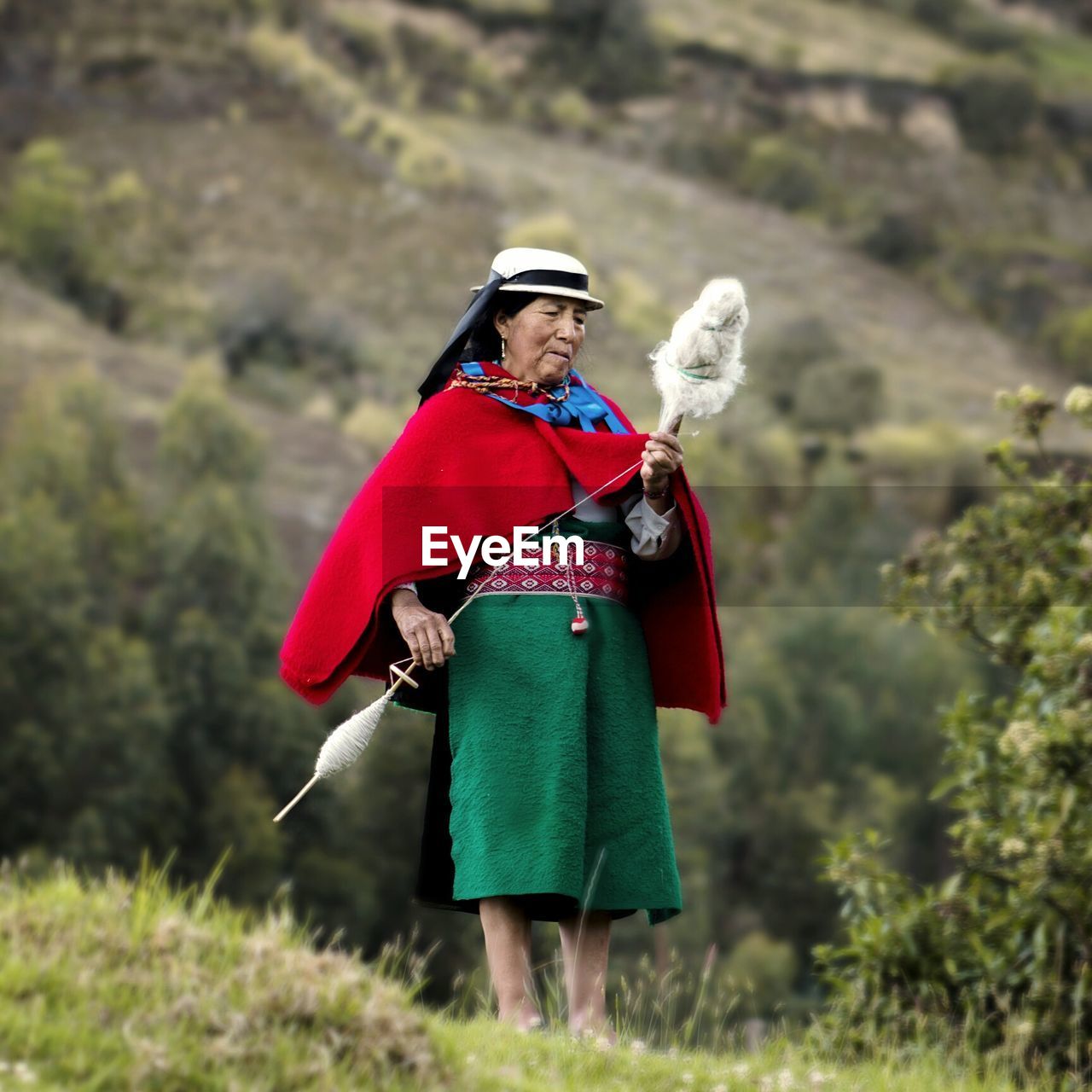 WOMAN STANDING ON FIELD