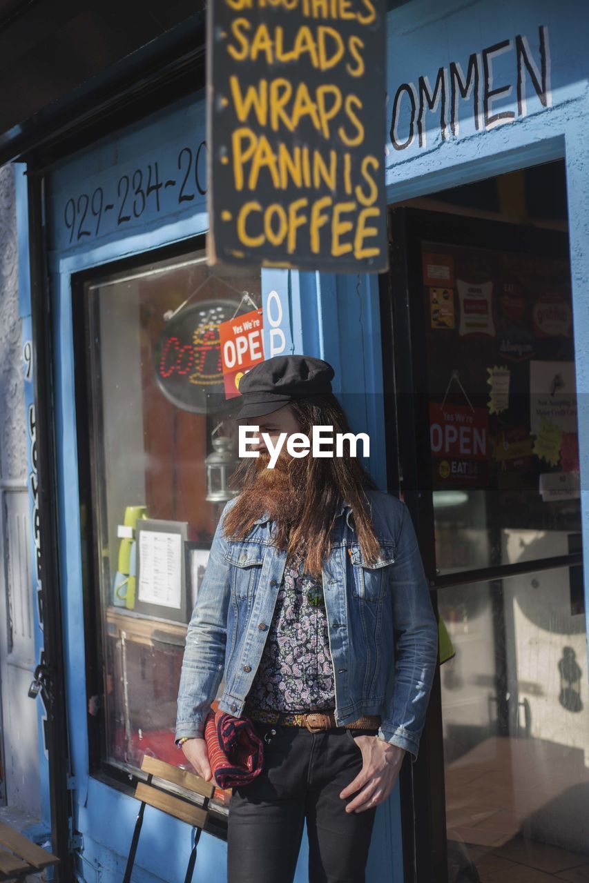 Young man exiting a store