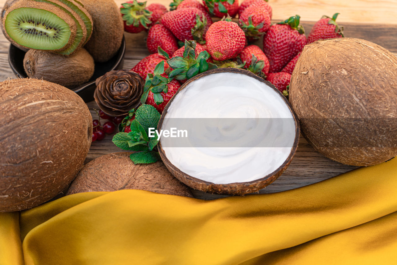 HIGH ANGLE VIEW OF FRUITS AND PLANTS ON TABLE