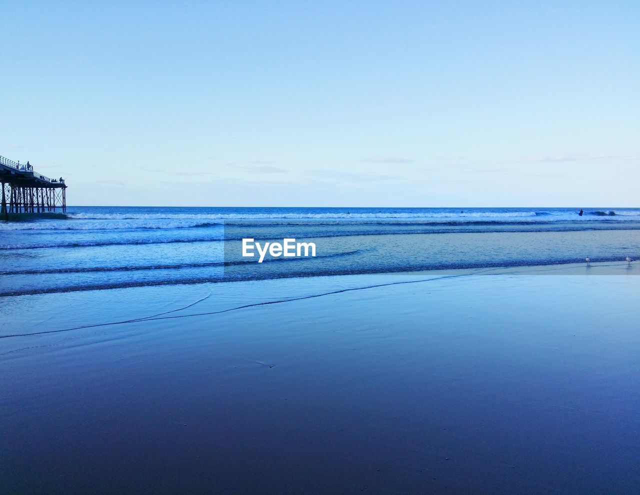 View of calm blue sea against clear sky