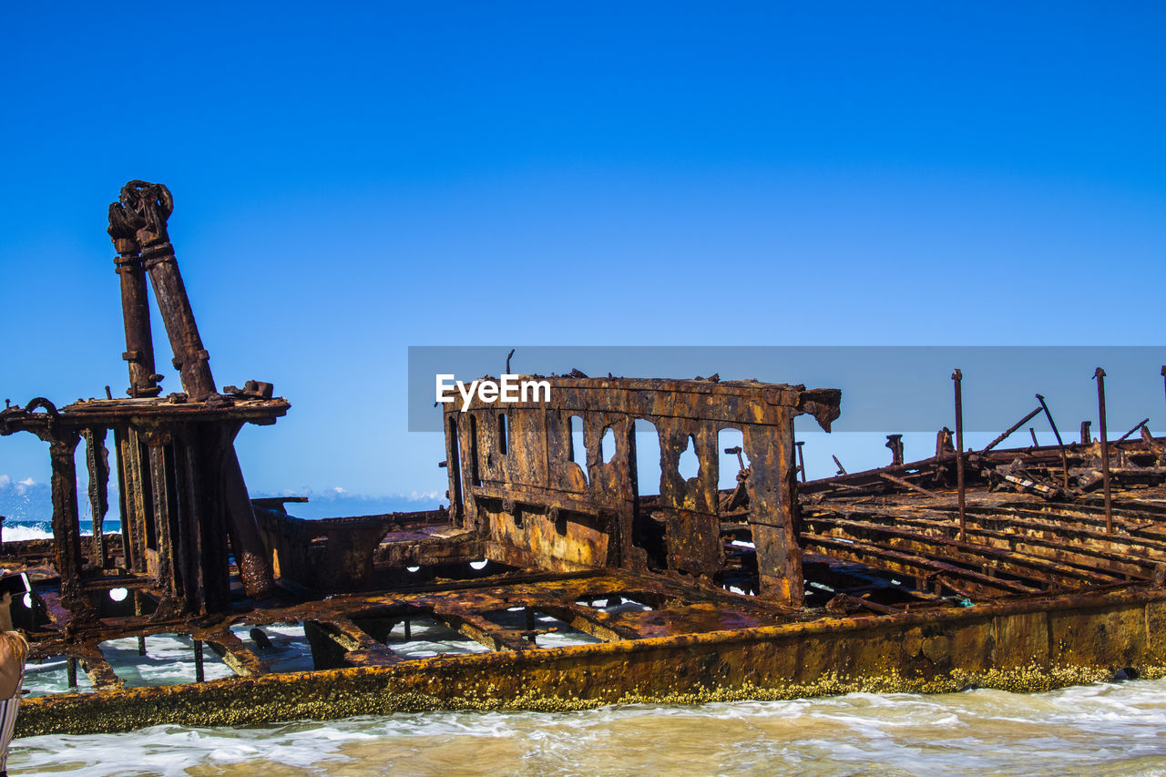 ABANDONED BUILT STRUCTURE AGAINST BLUE SKY