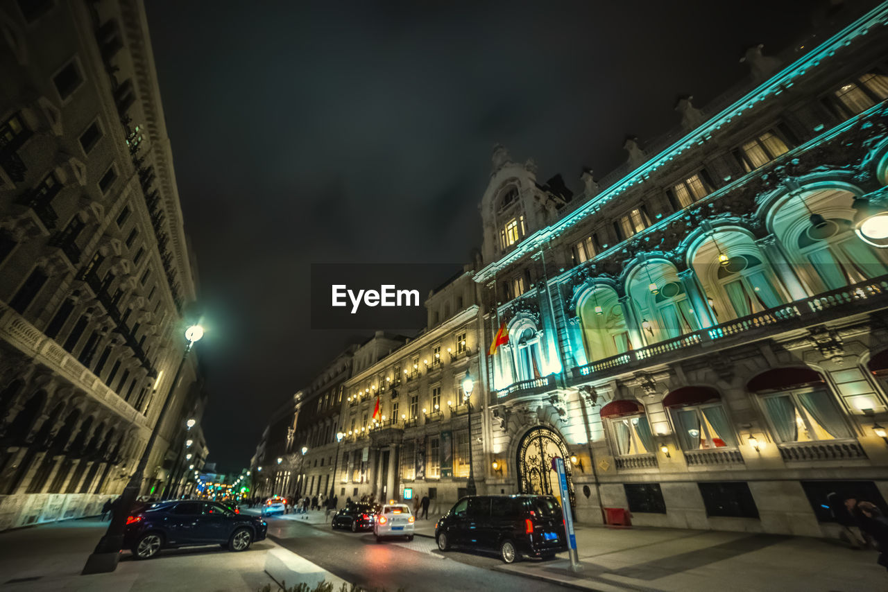 LOW ANGLE VIEW OF BUILDING AT NIGHT