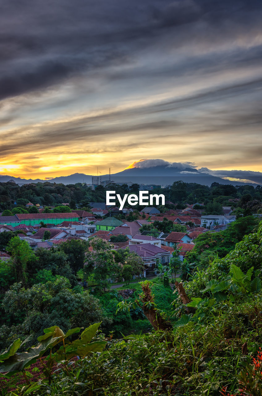 High angle view of buildings against sky during sunset