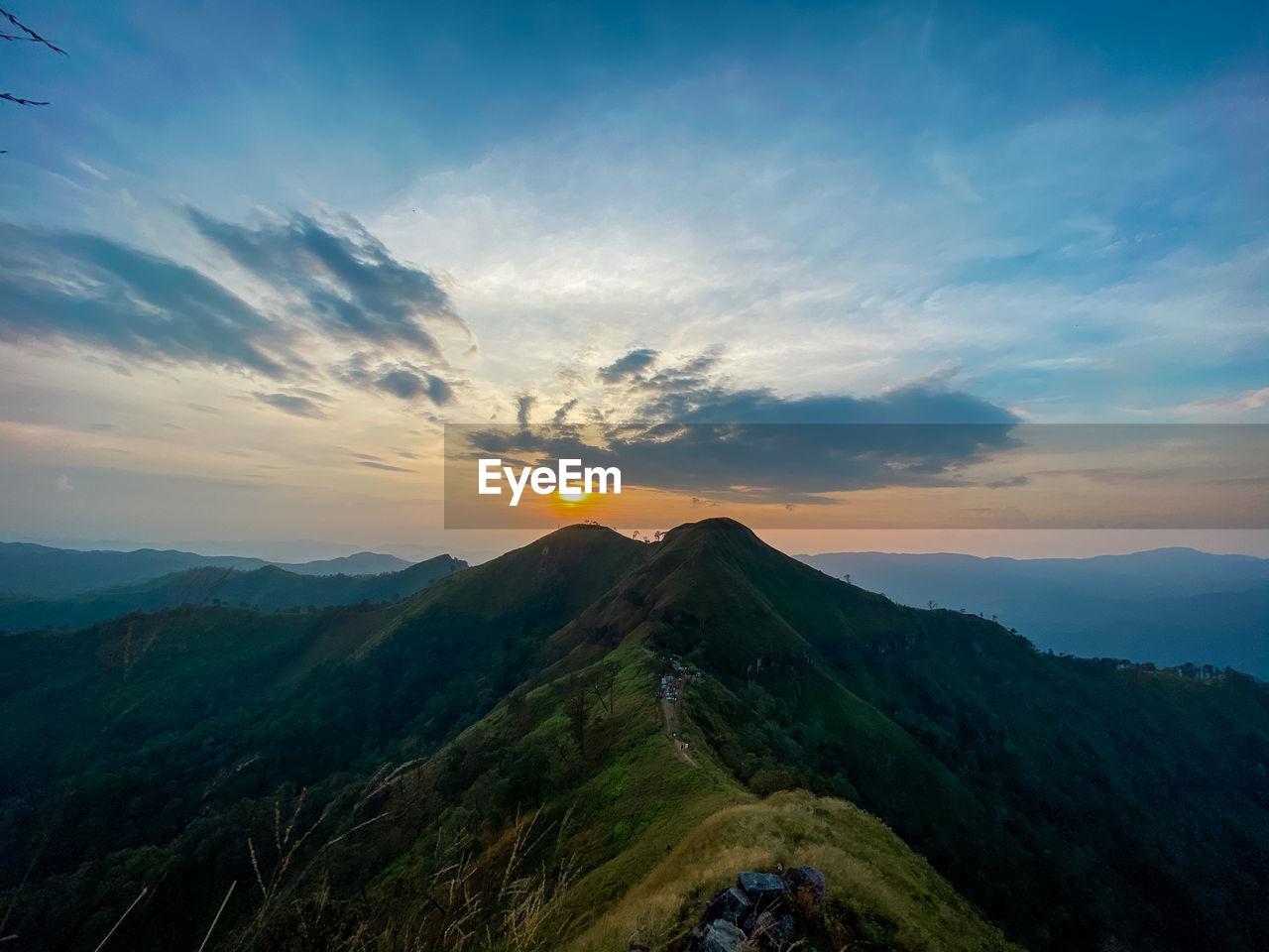 SCENIC VIEW OF MOUNTAINS DURING SUNSET