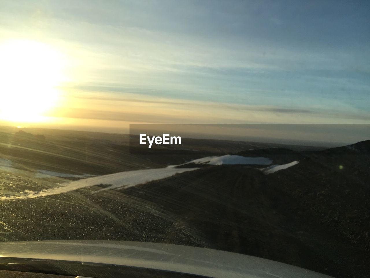 Aerial view of landscape against sky during winter