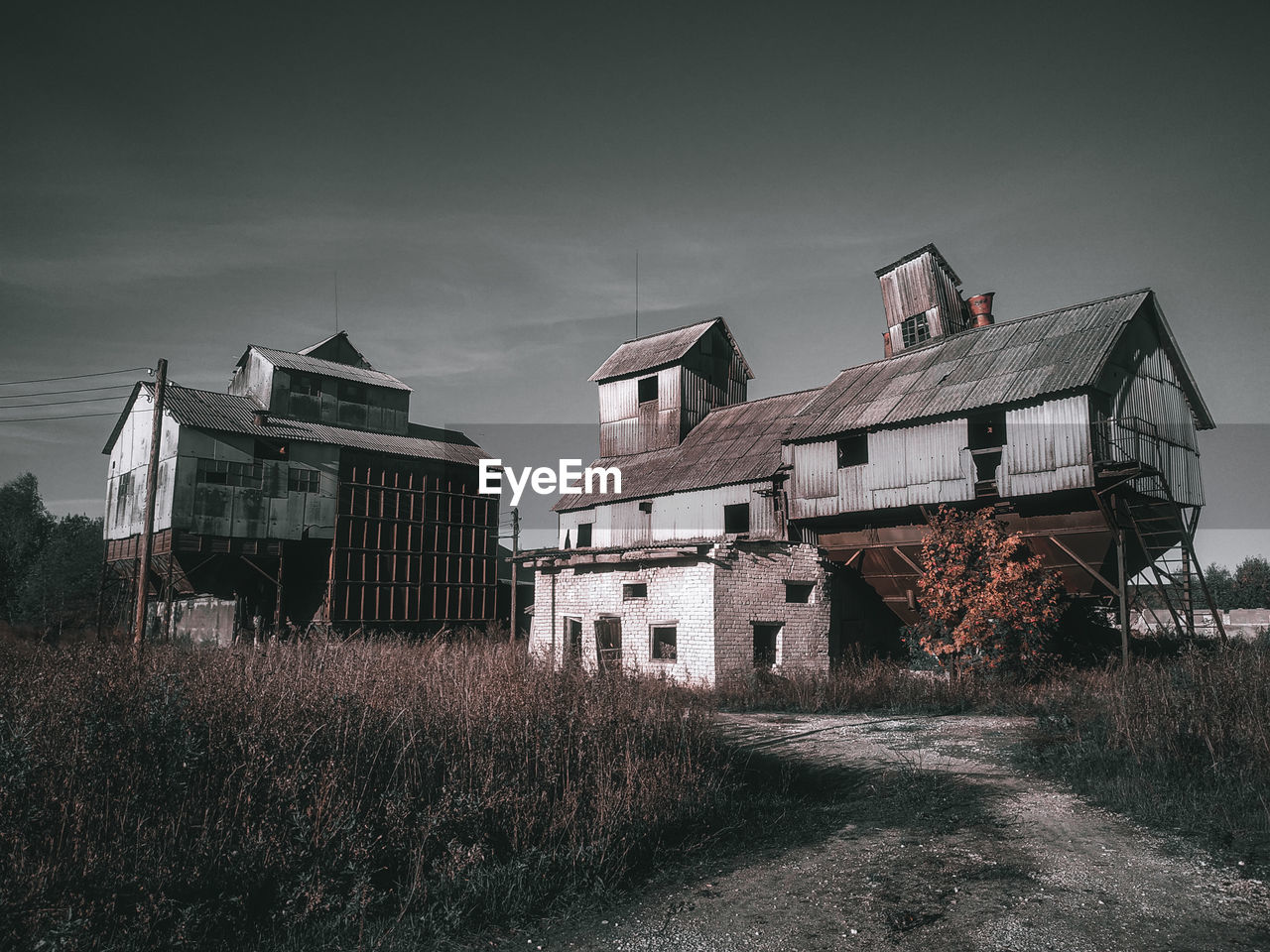 Old building in field against sky