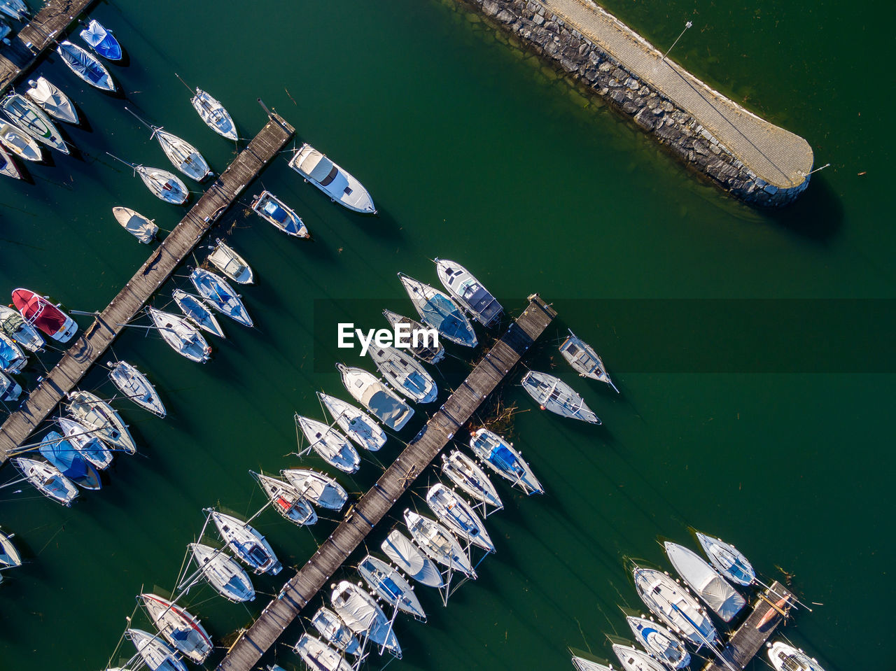 High angle view of boats moored at harbor