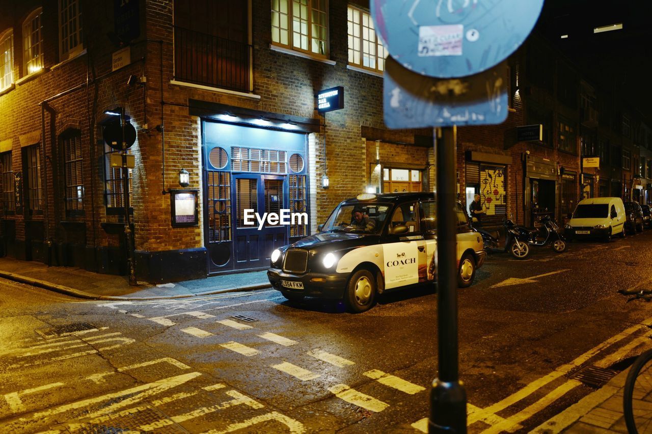 CARS ON STREET AT NIGHT