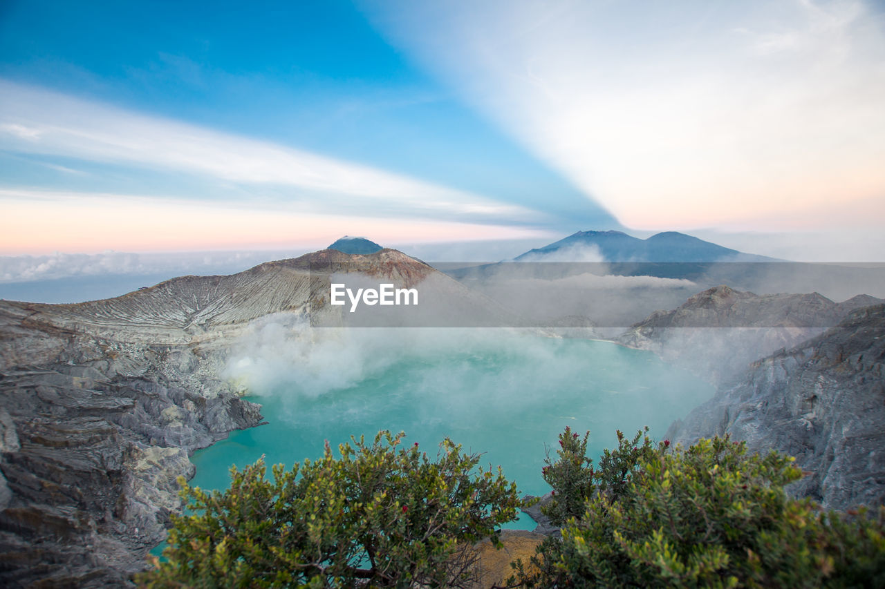 High angle view of hot spring by rock formation