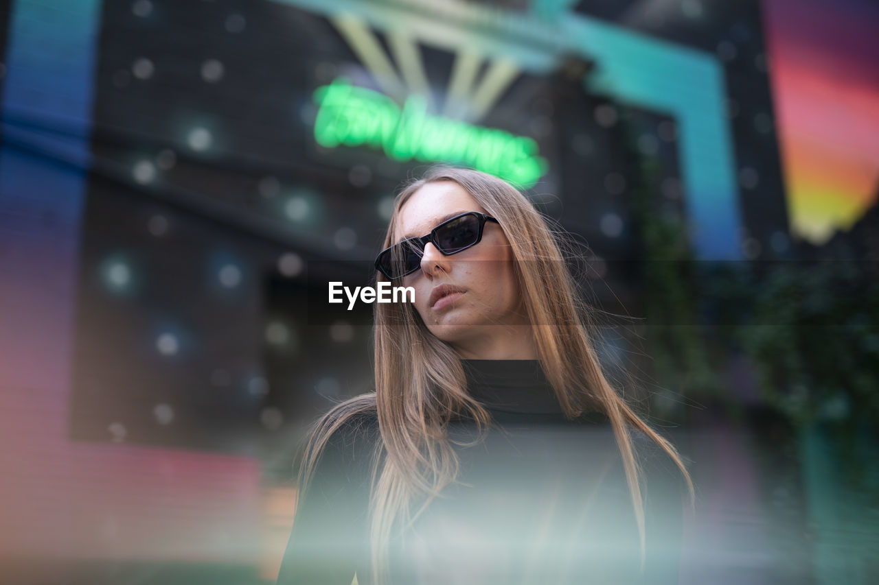 Portrait of young woman wearing sunglasses