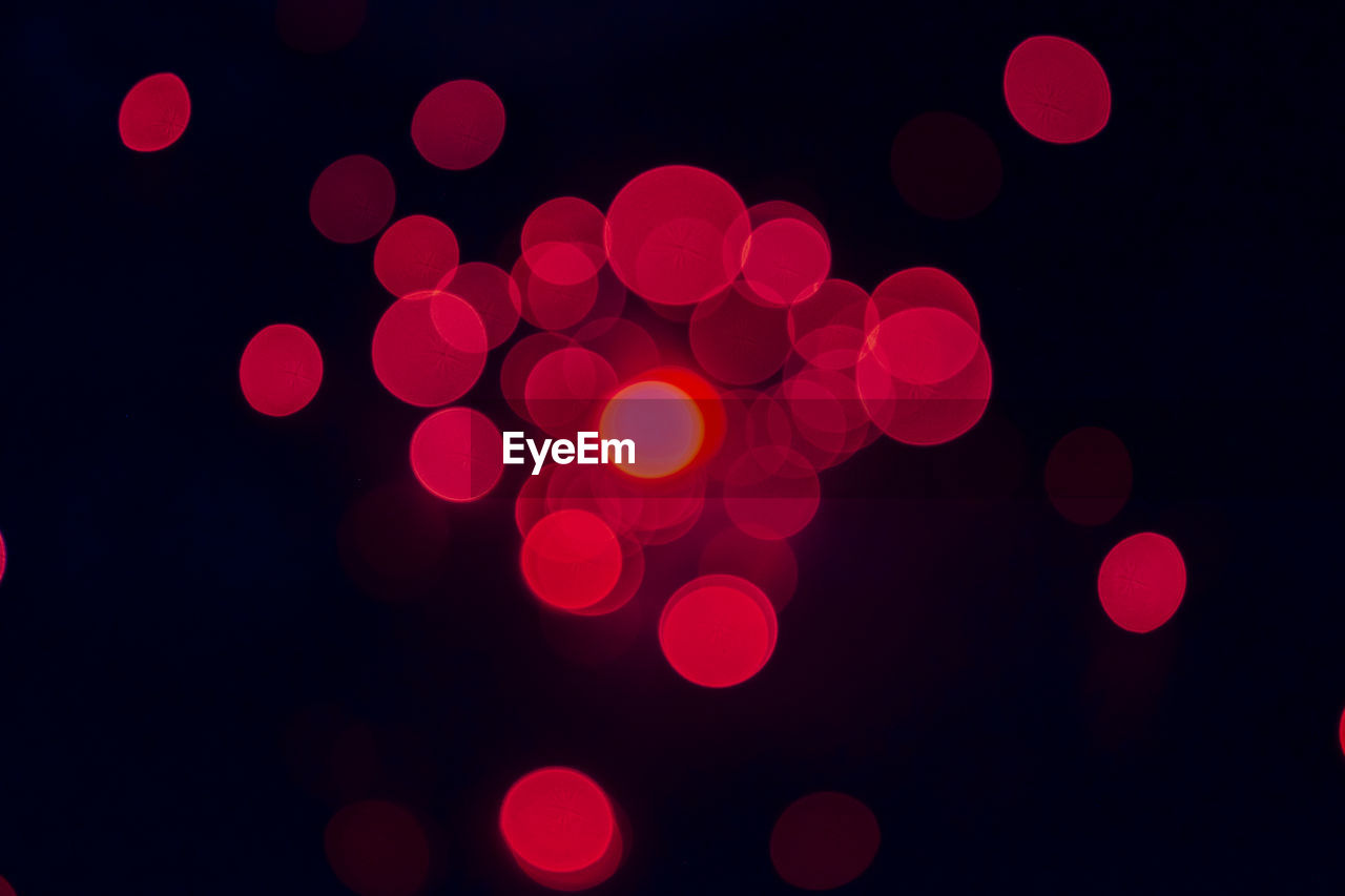 Defocused image of illuminated lights at night