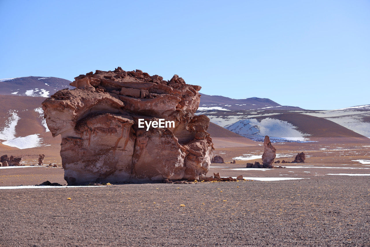 scenics - nature, sky, natural environment, landscape, environment, nature, mountain, beauty in nature, rock, travel destinations, land, travel, clear sky, desert, tranquility, non-urban scene, day, blue, snow, no people, mountain range, tranquil scene, cold temperature, winter, rock formation, sunny, outdoors, remote, geology, extreme terrain, sand, climate, tourism, valley, physical geography, wilderness, sunlight, plateau