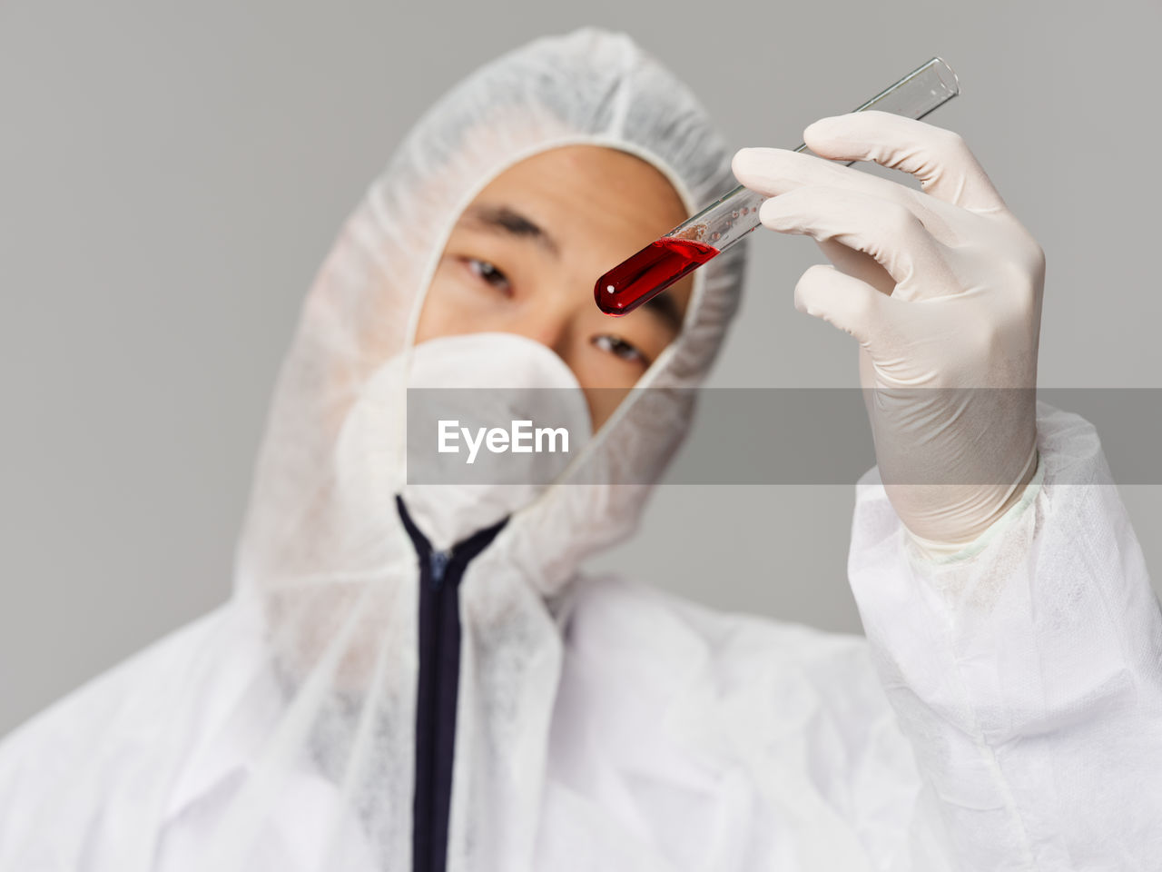 cropped hand of dentist holding dental equipment