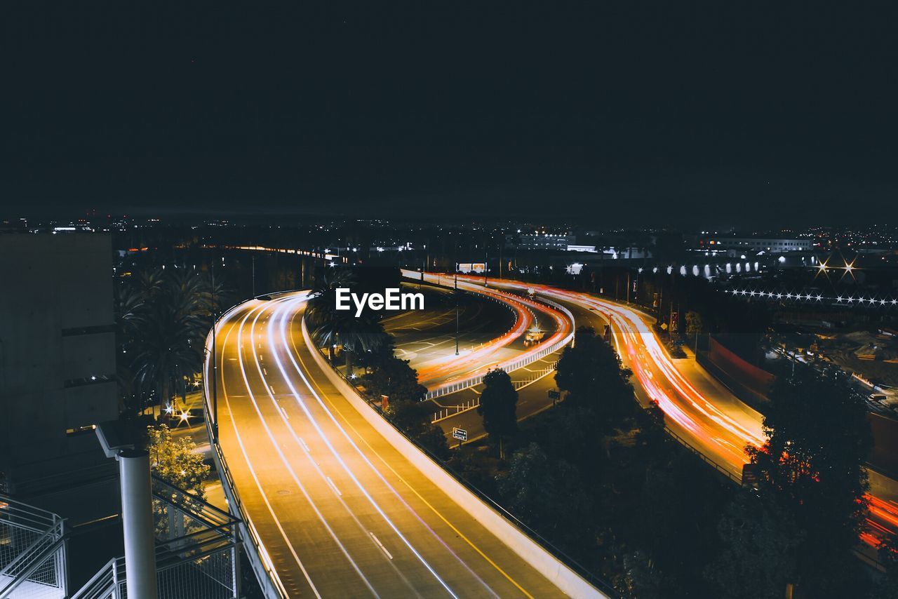 High angle view of light trails on road at night