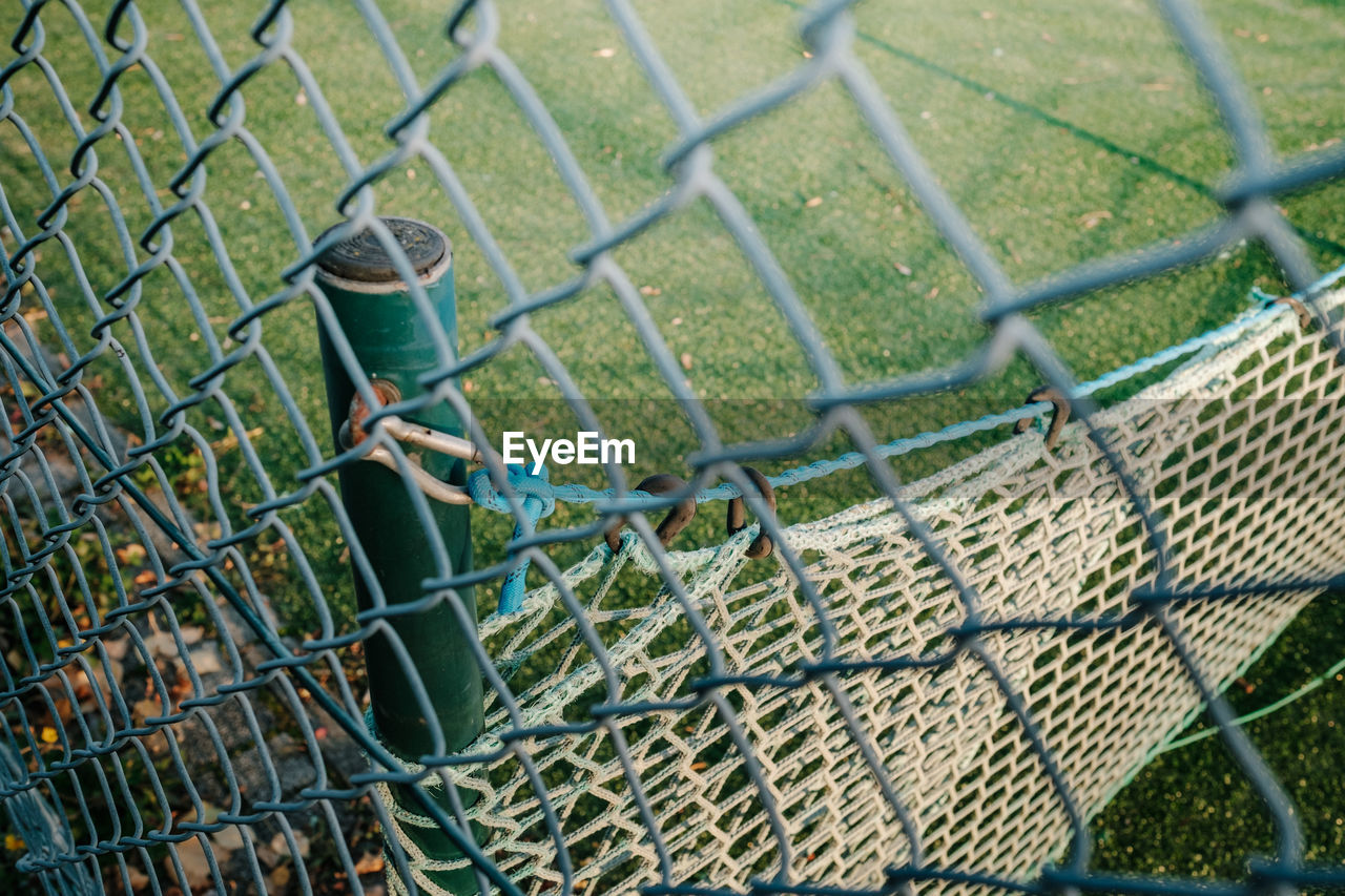 HIGH ANGLE VIEW OF CHAINLINK FENCE AT FARM