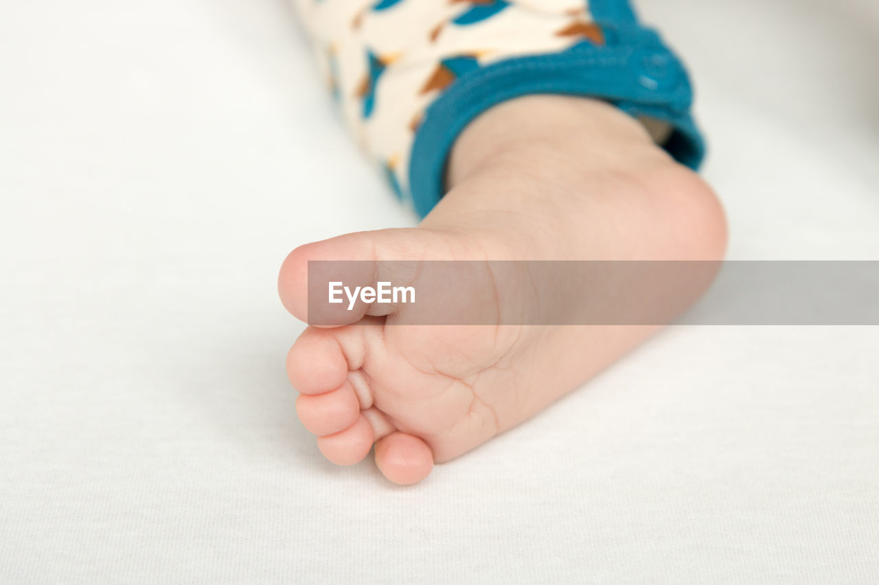 Low section of baby feet