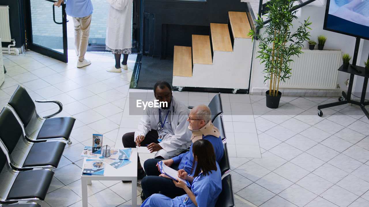 high angle view of business people working on street