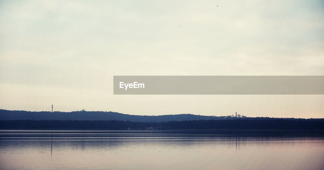 Tranquil view of lake against sky