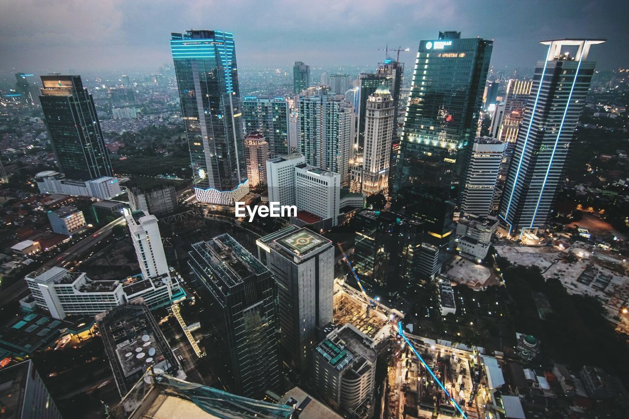 High angle view of modern buildings in city against sky