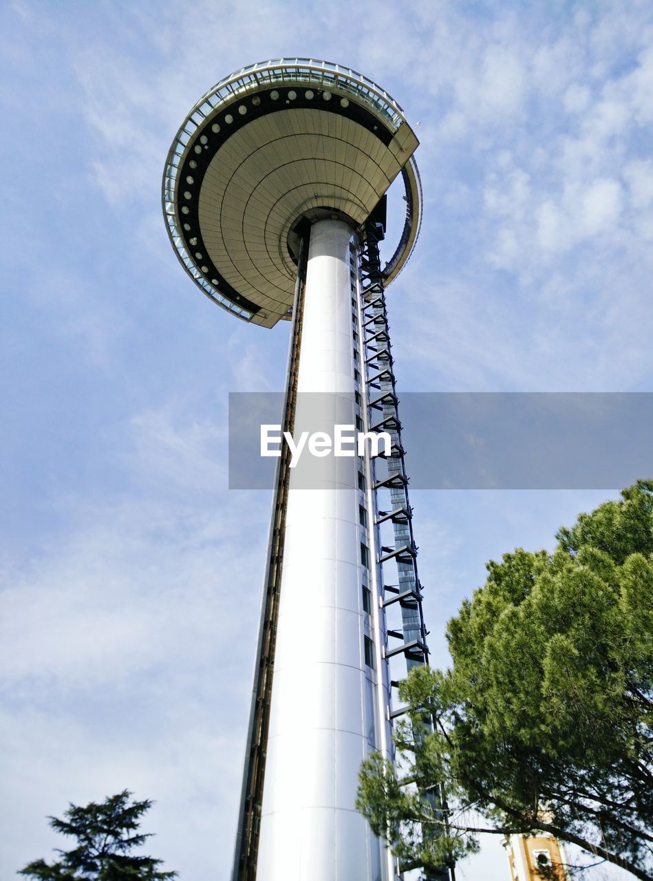 LOW ANGLE VIEW OF TOWER AGAINST CLOUDY SKY