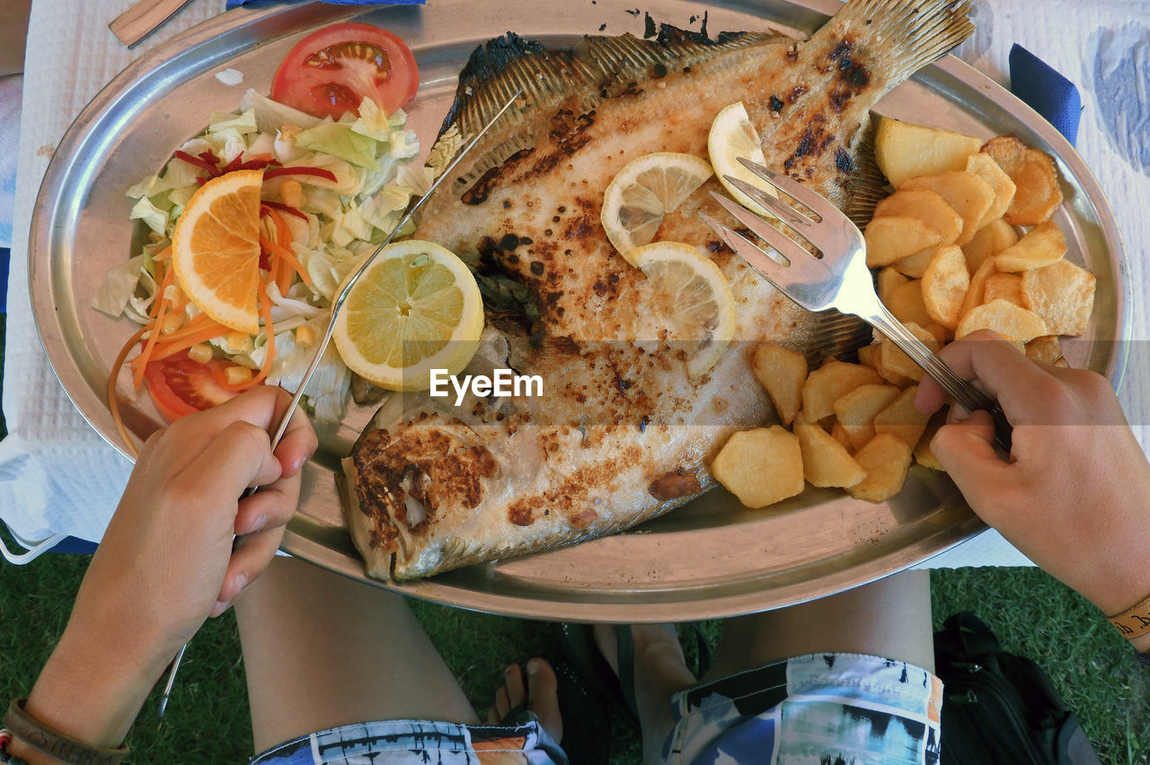 Midsection of woman having seafood