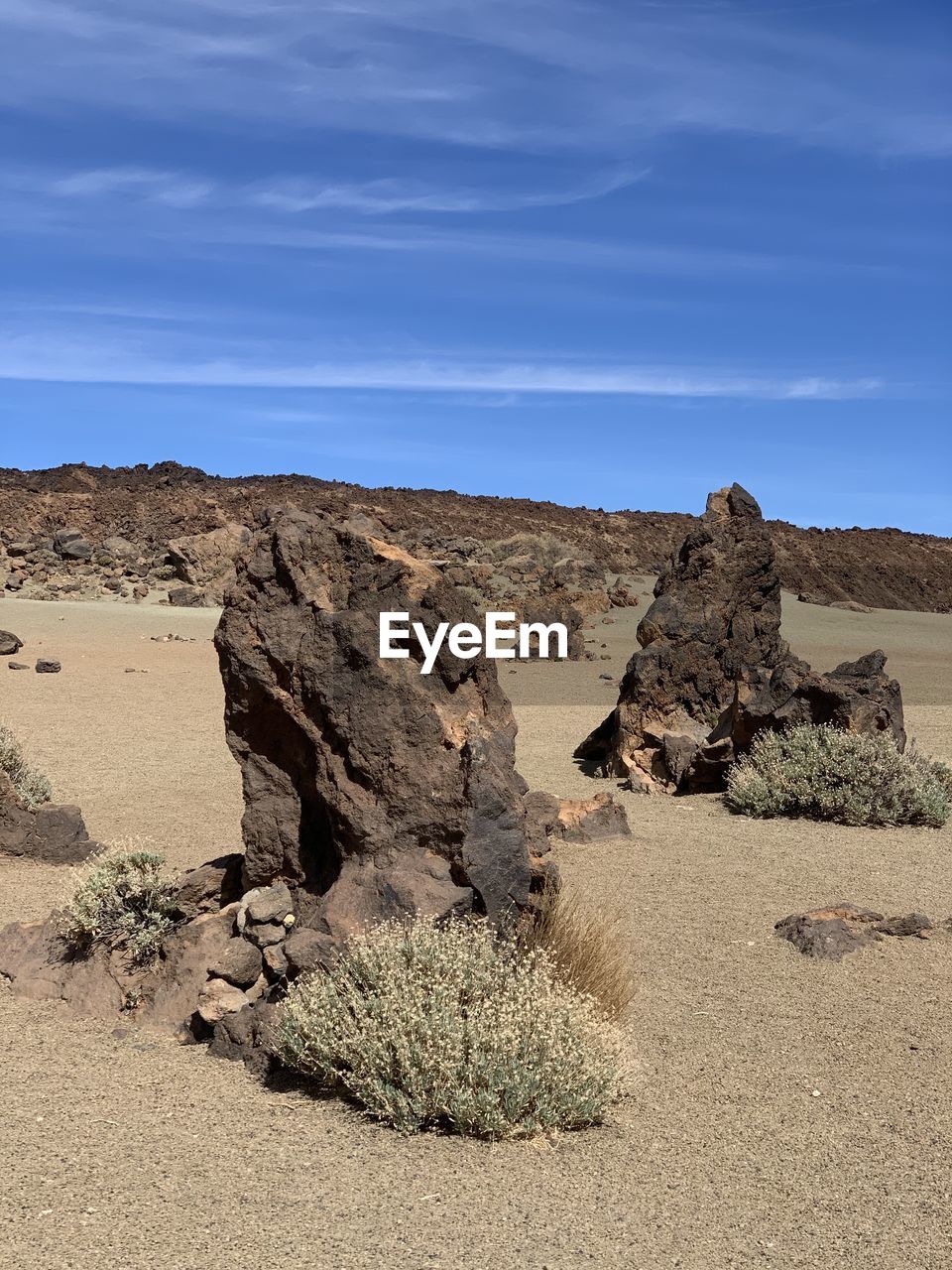 Rock formations on landscape against sky