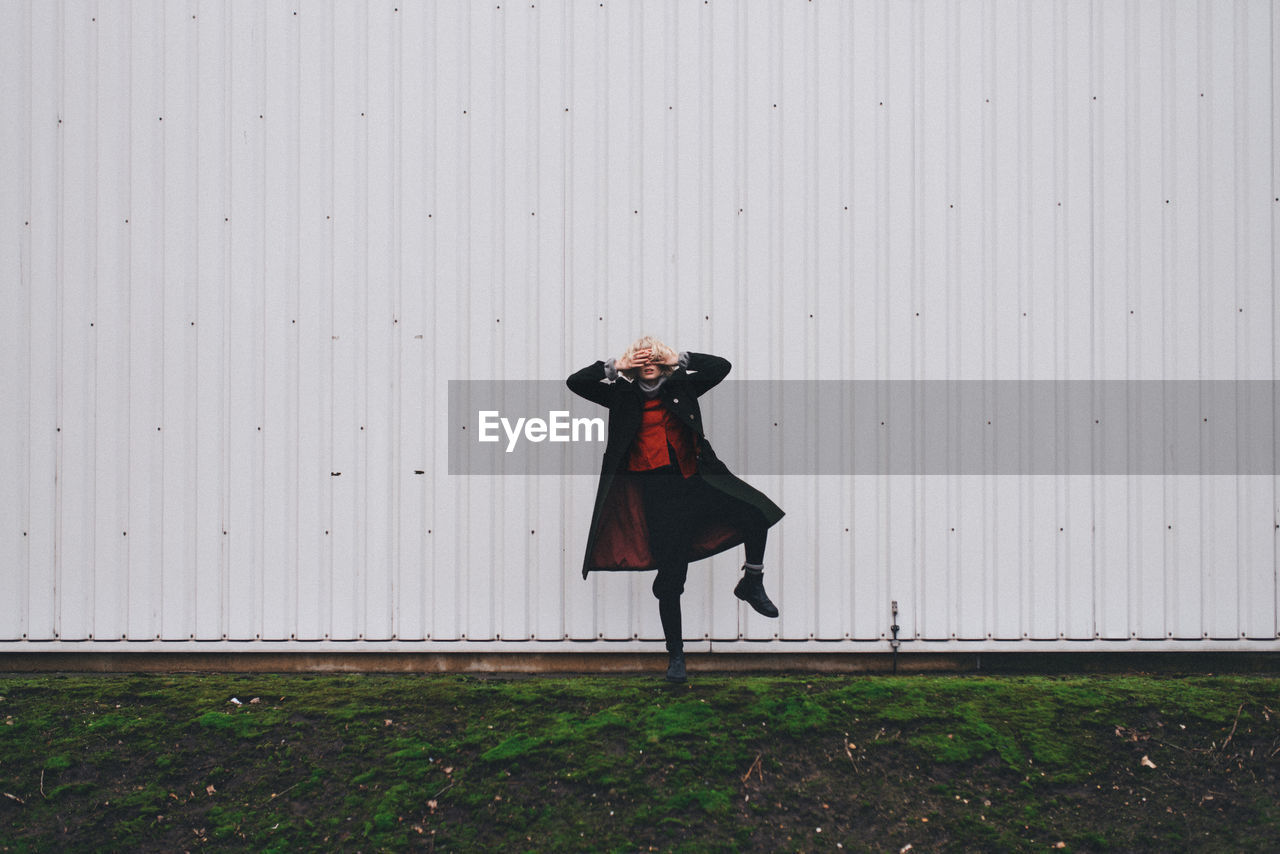 Woman standing on one leg