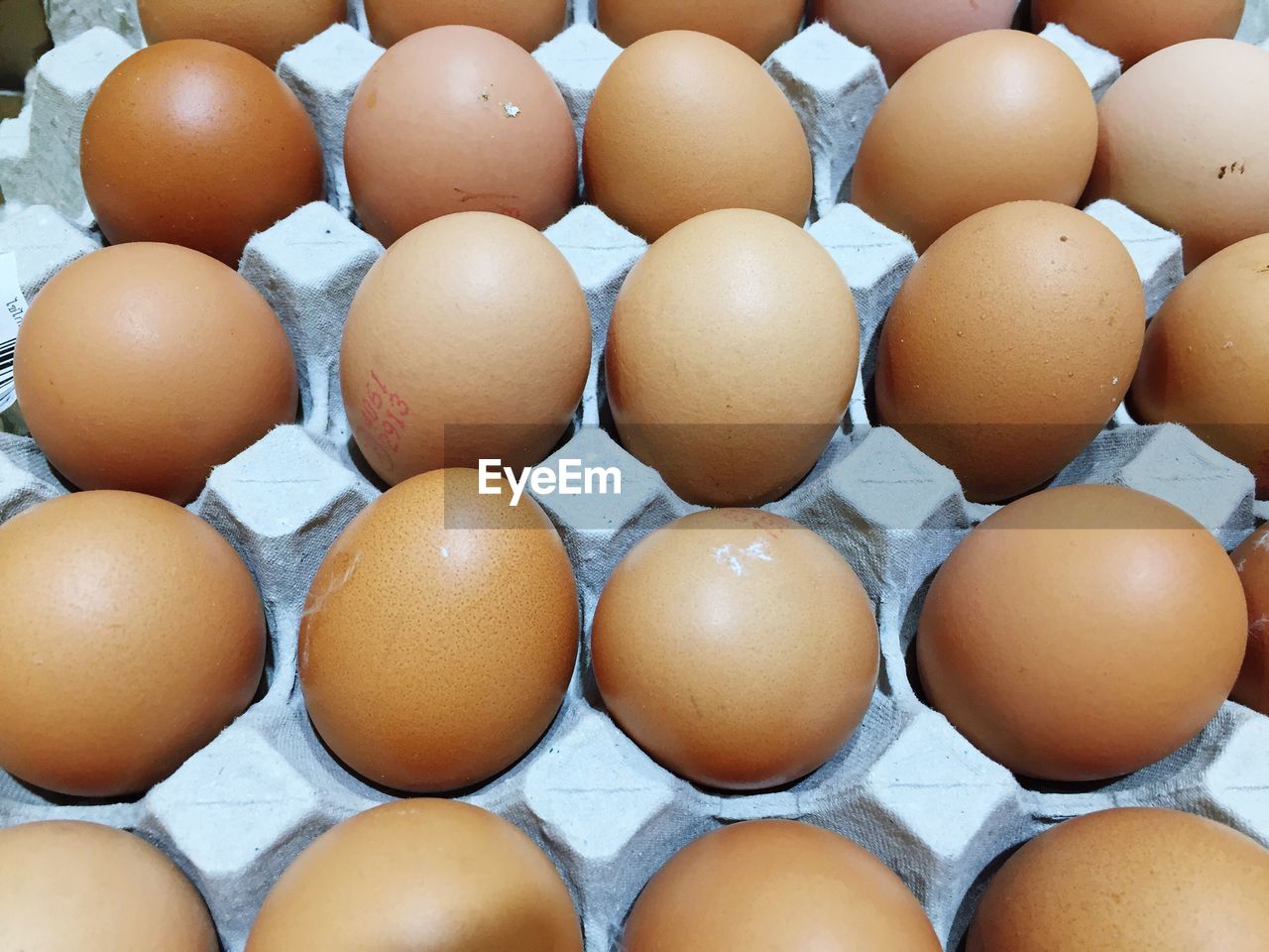 HIGH ANGLE VIEW OF EGGS IN MARKET STALL