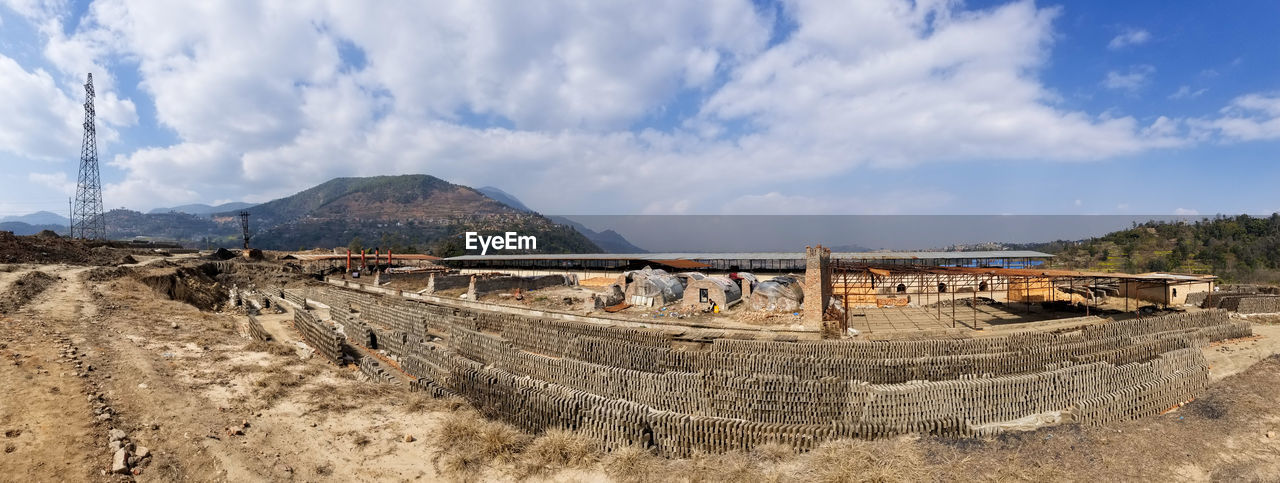 Panoramic view of arid landscape against sky