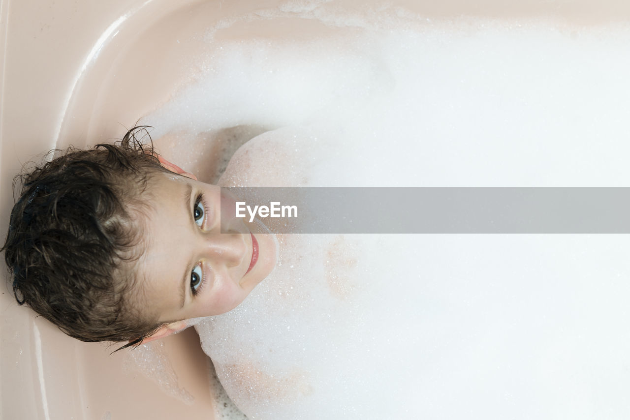 Portrait of boy in bathtub