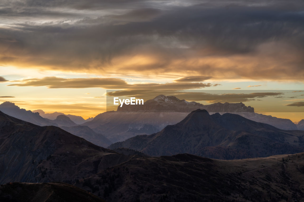 mountain, environment, sky, landscape, scenics - nature, cloud, beauty in nature, mountain range, sunset, nature, dramatic sky, dawn, land, travel, travel destinations, tranquility, sun, mountain peak, outdoors, sunlight, no people, tourism, tranquil scene, cloudscape, awe, wilderness, twilight, non-urban scene, trip, vacation, idyllic, valley, horizon, activity, rock, moody sky, fog, holiday, cold temperature, snow, sunbeam, extreme terrain, high up, winter, leisure activity, dramatic landscape