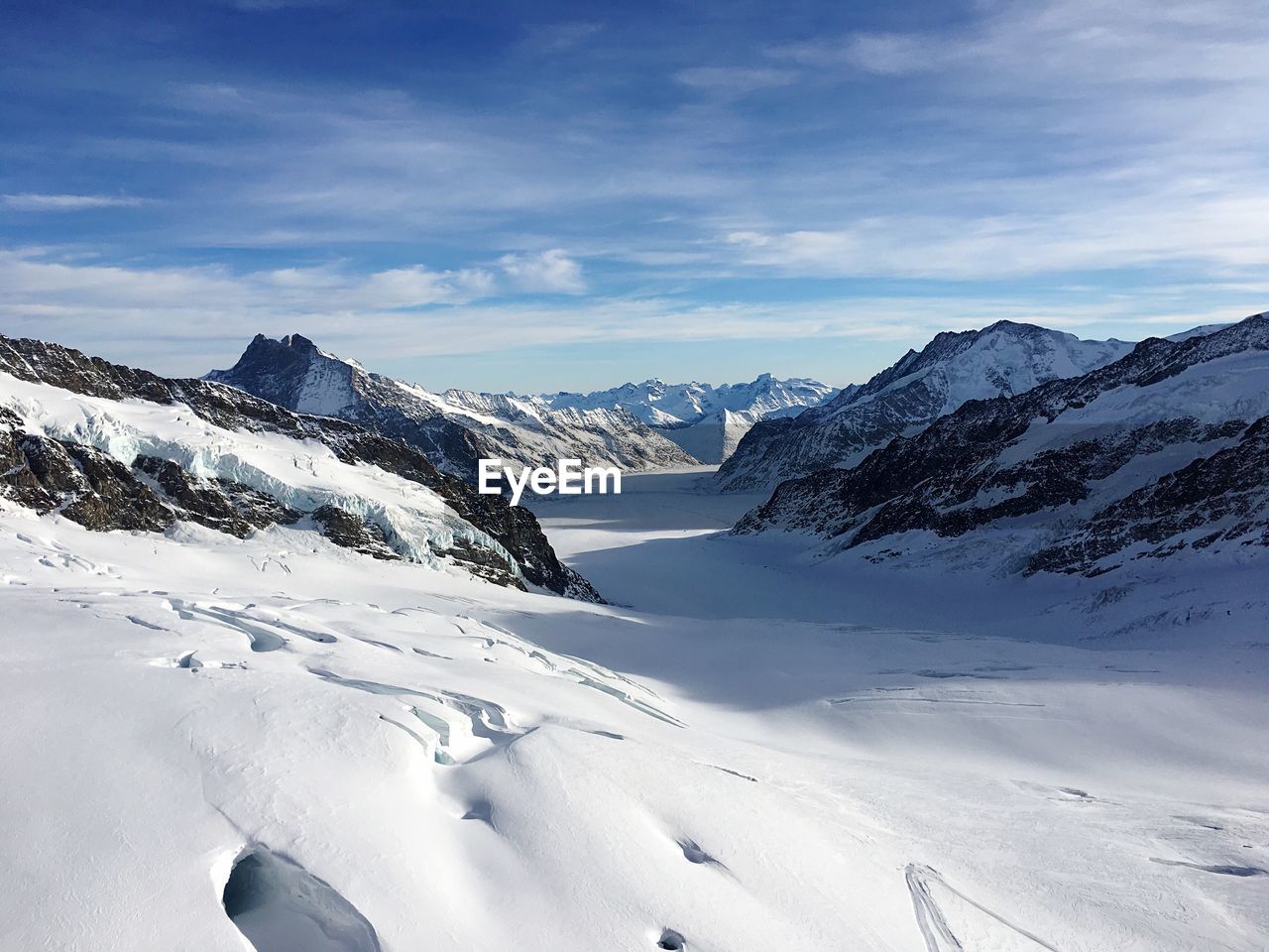 Scenic view of mountains against sky during winter