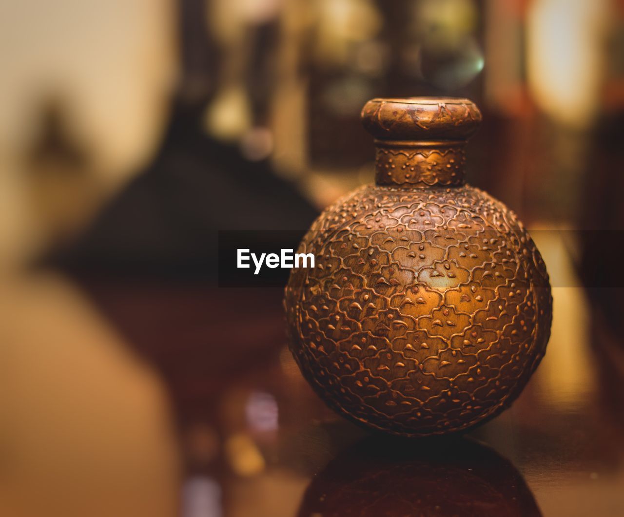 Close-up of antique container on table