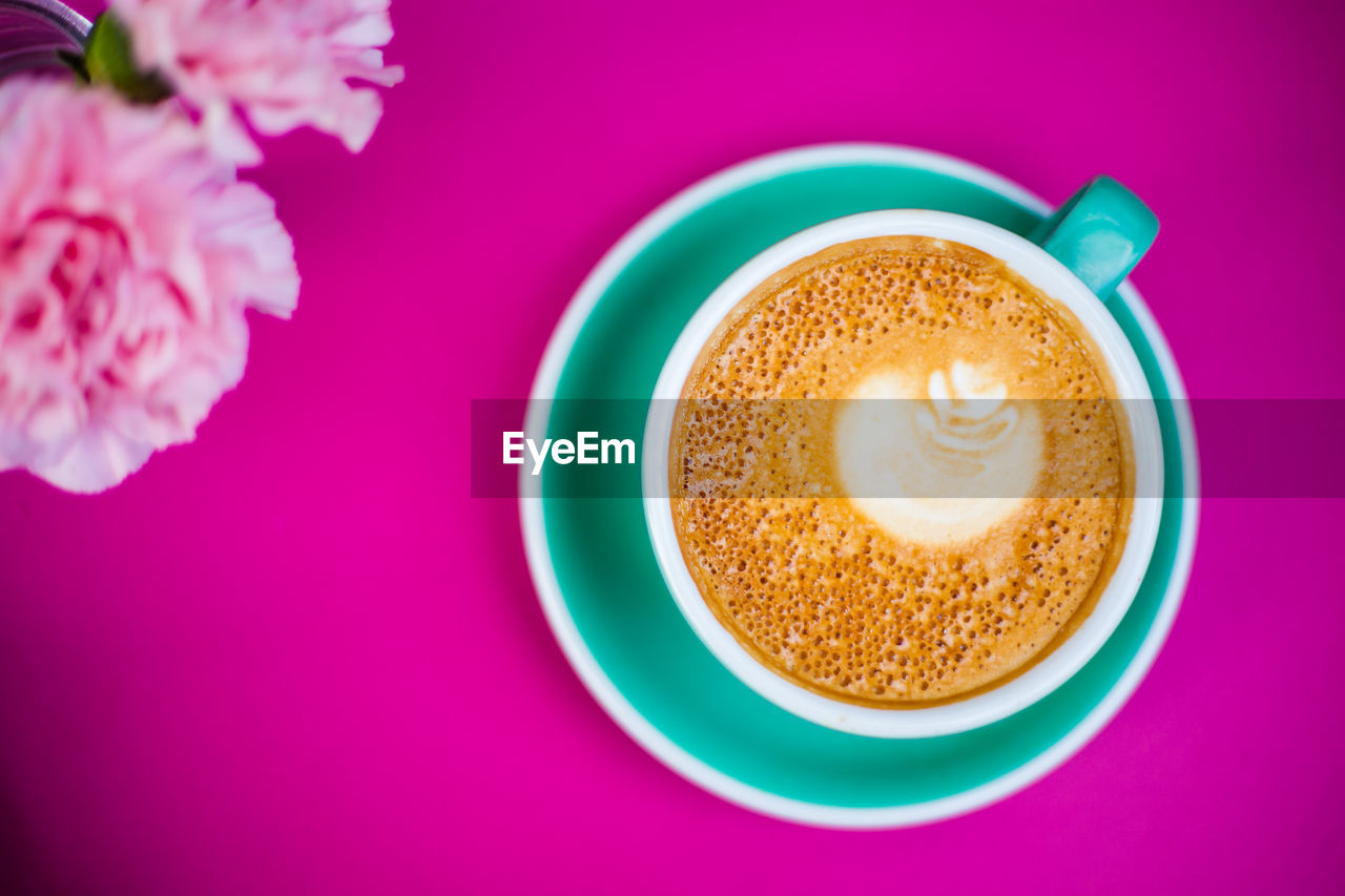 HIGH ANGLE VIEW OF COFFEE ON TABLE WITH PINK