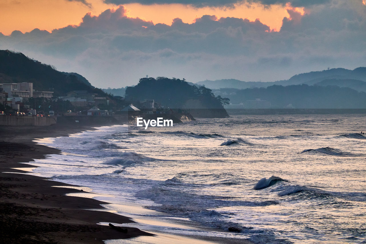 Scenic view of sea against sky during sunrise