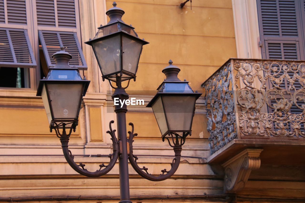 LOW ANGLE VIEW OF STREET LIGHT AND BUILDING