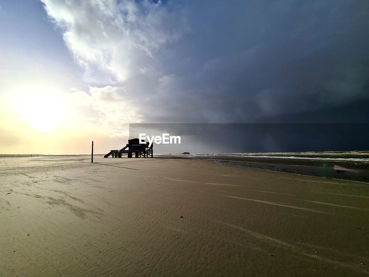 sky, horizon, cloud, land, nature, environment, sea, beach, water, beauty in nature, landscape, sand, scenics - nature, ocean, sunset, coast, sunlight, dramatic sky, wave, dusk, shore, outdoors, tranquility, travel, transportation, sun, travel destinations, no people, motion, tranquil scene, storm, non-urban scene, cloudscape