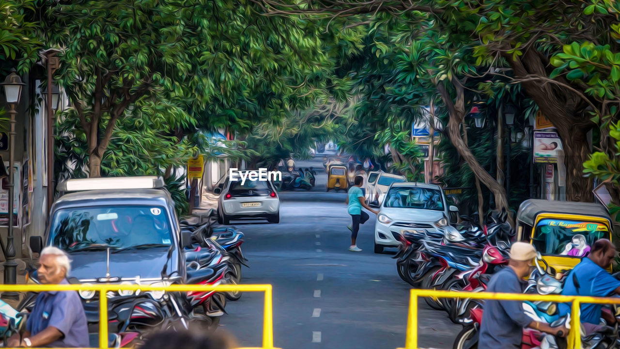 VEHICLES ON ROAD IN CITY