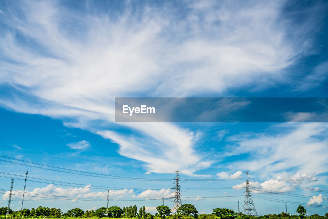 LOW ANGLE VIEW OF POWER LINES AGAINST BLUE SKY