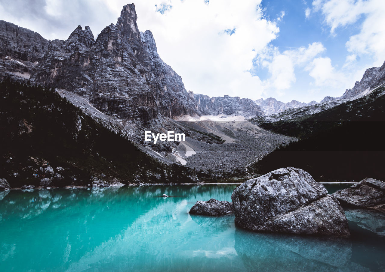 Scenic view of lake and mountains against sky