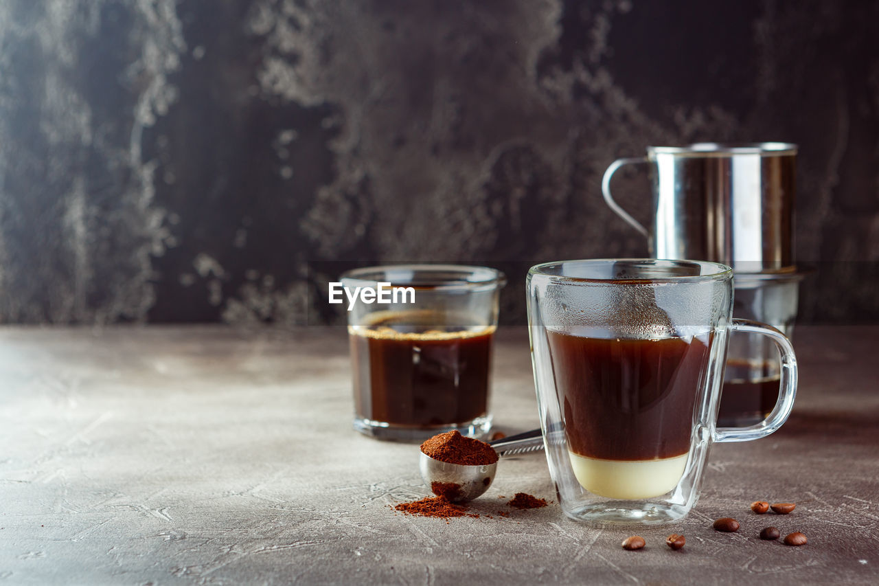 CLOSE-UP OF COFFEE ON TABLE