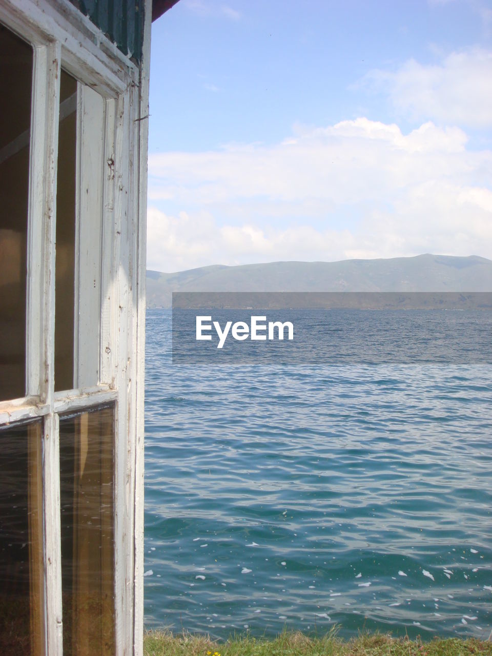 Tourist resort window at lakeshore