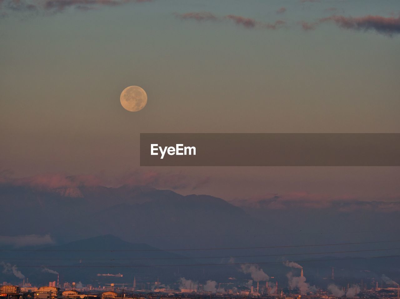 Scenic view of moon at sunset