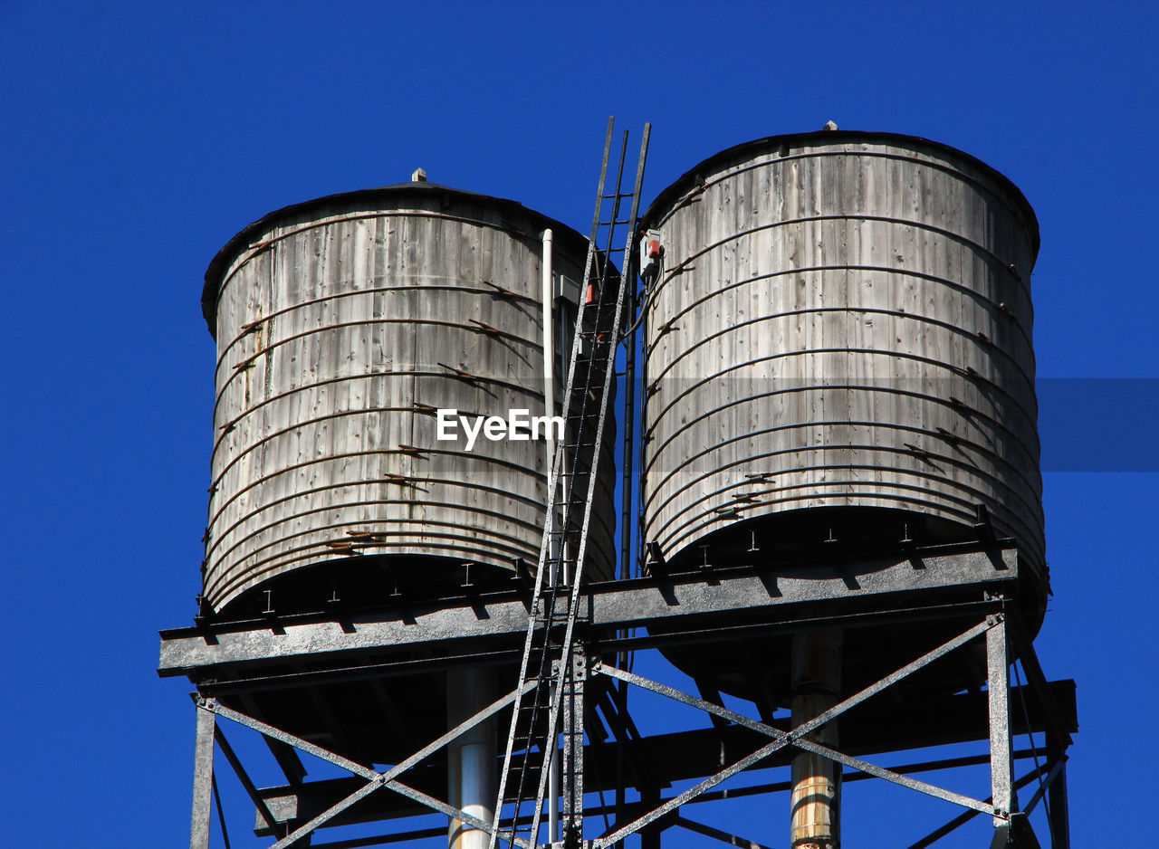 Low angle view of water tower against clear sky