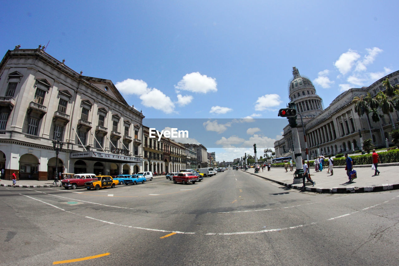 CARS ON ROAD IN CITY