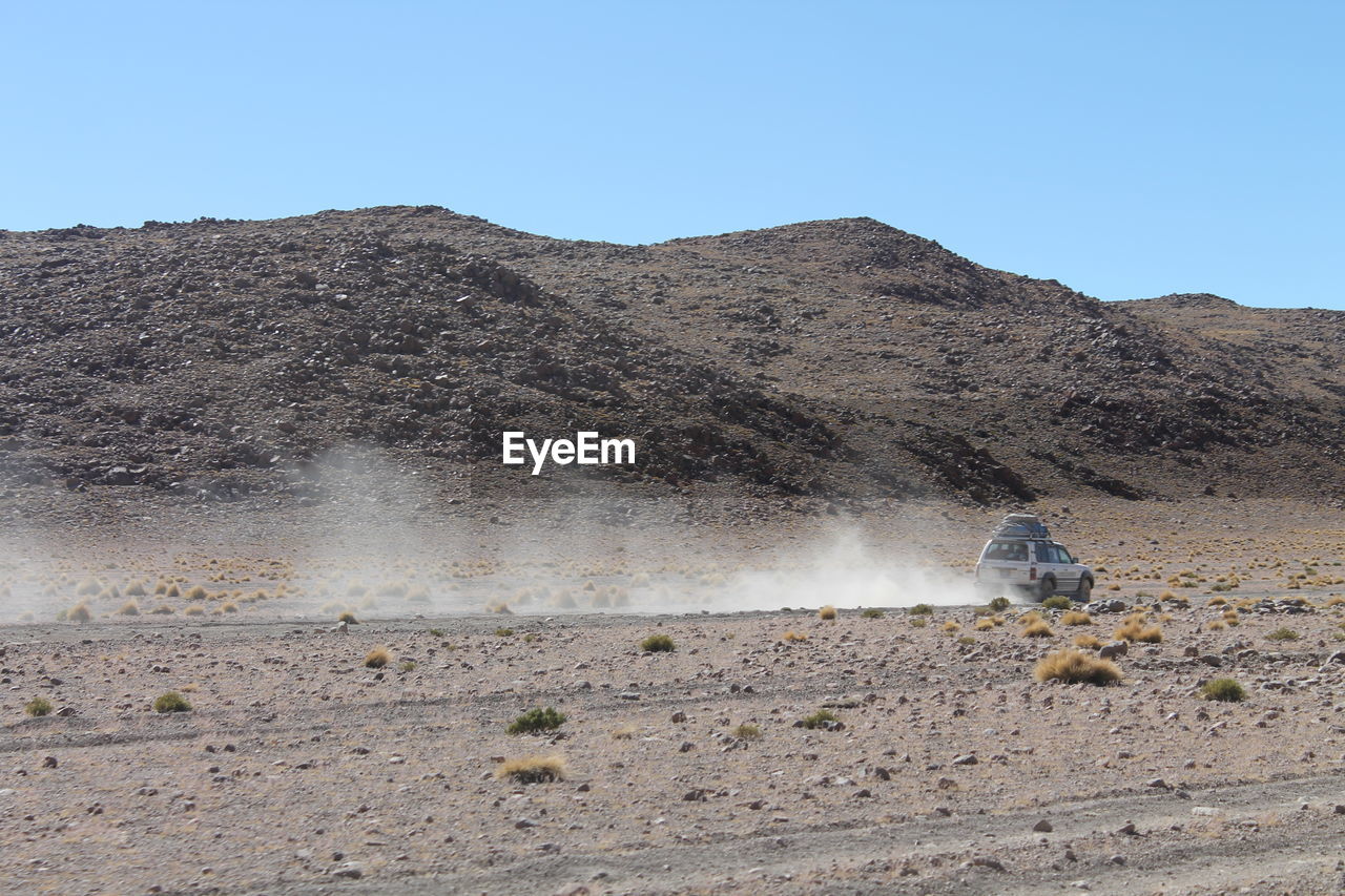 Scenic view of desert against clear sky