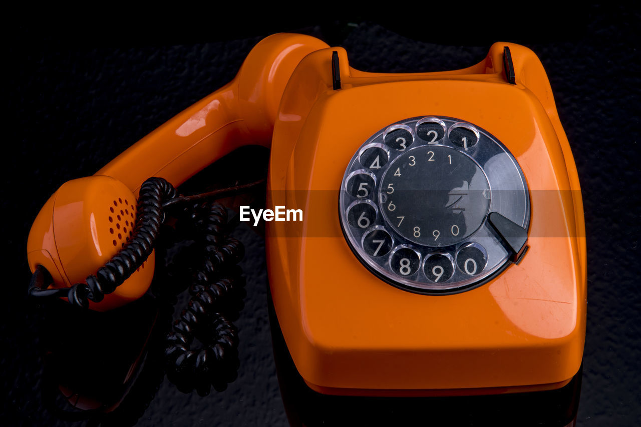 CLOSE-UP OF TELEPHONE ON TABLE